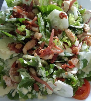Ceasar's Salad with organic lettuce, bacon, chicken stripes with home made dressing
